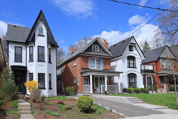 Sticker - Street with row of narrow old brick detached houses with gables