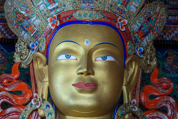 Wall Mural - Colorful statue of Maitreya Buddha at Tibetan Buddhist Thiksey Monastery near mountain village Leh in ladakh region, north India