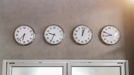 Closeup group of black and white clock with shadow for decorate show the time in. isolated on background , beautiful 4 clock picture in different time.