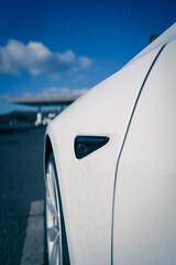 Poster - Vertical shot of the side of a modern white car