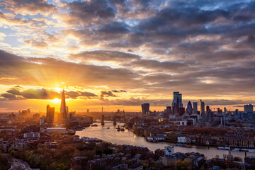 Wall Mural - The urban skyline of London, United Kingdom, with Tower Bridge, Thames river and City district during a colorful sunset