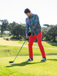 © mavericksun - A young Caucasian male playing golf on a professional golf course