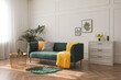 © New Africa - Stylish living room interior with comfortable green sofa