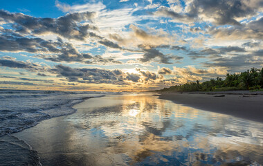 Wall Mural - Beautiful sunset sky with clouds on the beach in Matapalo, Costa Rica. Central America. Sky background on sunset. Tropical sea.