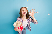 Photo Of Optimistic Red Hairdo Girl Eat Pop Corn Wear Shirt Jeans Isolated On Blue Color Background
