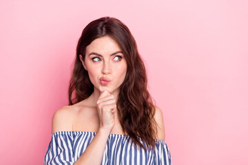 Poster - Photo of nice optimistic brunette lady hand chin look empty space wear blue dress isolated on pastel pink color background