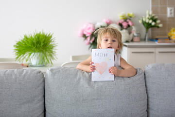 Poster - Cute toddler child, giving mom card with heart for Mothers day