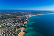Aerial view of the scenic Algarve coastline, with beaches and resorts; Concept for summer vacations in Portugal
