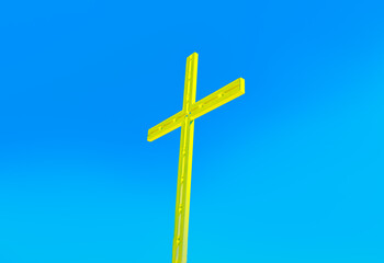 Golden cross against blue sky , religious symbol . Easter Day 