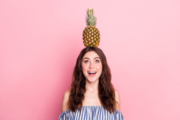 Poster - Photo of shocked pretty young woman dressed striped outfit holding head fruit looking up empty space isolated pink color background