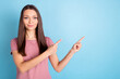 © deagreez - Photo of young charming attractive young woman point fingers empty space promo isolated on blue color background