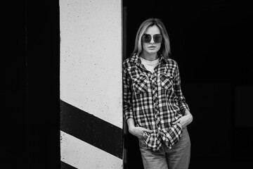 Poster - Fashion portrait of beautiful woman with beautiful face, wearing grunge plaid shirt. Posing alone.