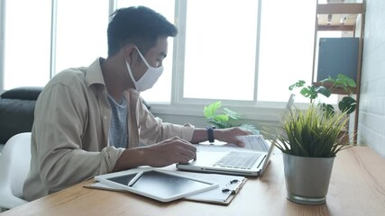 Fototapete - Web design Asian man using graphics tablet pen sketching drawing drafting design work from paper into digital user interface UI UX, with laptop computer, professional working from modern home offic
