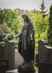 statue of a person in a cemetery