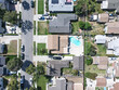 Aerial top view of Lakewood middle class neighborhood houses, city in Los Angeles County, California, United States.