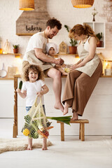 Wall Mural - happy family with their children cooking in the kitchen