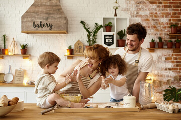 Wall Mural - happy family cooking in the kitchen