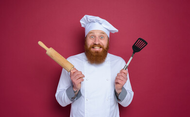 Canvas Print - Man chef with happy and surprised expression. burgundy color background