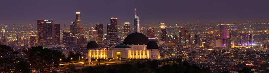 Panorama of Griffith Observatory at night with the Los Angeles skyline in the background. 