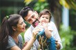 © chokniti - happy family with father and mother, and son child baby, childhood and parent in love together, smile kid and fun at home, enjoy outdoor life in summer