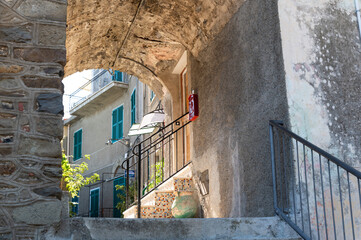 Wall Mural - Fascinating glimpses of the alleys of Corniglia. Narrow stone streets and charming atmosphere of the Cinque Terre i Ligura, Italy. Famous travel destinations.