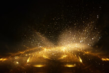 Background Of Abstract Gold And Black Glitter Lights. Defocused