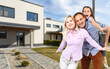 © Angelov - Happy family. family on the background of a new house. Modern new house is on the background.