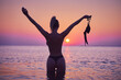 © Kalim - Silhouette of sexy woman posing at sunrise at the beach