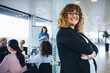 © Jacob Lund - Portrait of smiling businesswoman standing in office
