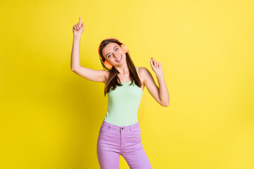 Sticker - Photo of funny lovely lady dance beaming white smile wear earphones green singlet isolated yellow color background