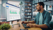 © Gorodenkoff - Caucasian Specialist Working on Desktop Computer in Creative Home Living Room. Freelance Male is Doing Market Analysis and Creates Report with Charts for Clients and Employer.