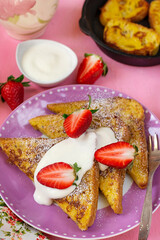 Wall Mural - Sweet French toasts served with whipped cream and strawberries