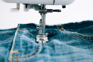 modern sewing machine for repairing or sewing clothes denim sewing process. sewing equipment selecti