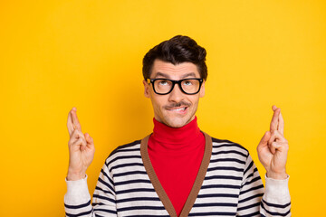 Sticker - Photo of young guy bite lips teeth crossed fingers wish hope pray luck wear red turtleneck isolated over yellow color background