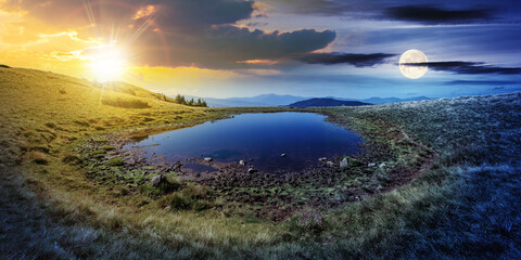 Wall Mural - day and night time change concept above pond on the mountain meadow. wonderful summer landscape with