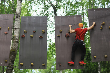 male climber rope park, outdoor activity training, guy, man extreme weekend in the forest