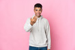 © luismolinero - Young Brazilian man isolated on pink background inviting to come with hand. Happy that you came