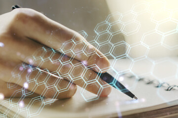 Poster - Creative abstract technology sketch with hexagon grid and man hand writing in notepad on background, future technology and AI concept. Double exposure