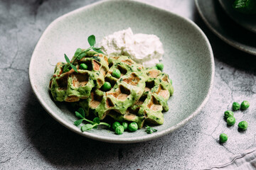 Wall Mural - Zucchini waffles with cream cheese. Vegetarian green waffles