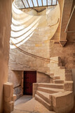 The spiral staircase leading to the bell tower inside the Montmajour Abbey near Arles, France, former medieval fortified monastery, now historical monument.
