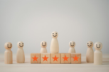 Wall Mural - Smiley face on wooden miniature figure with five star on wooden cube for the best customer evaluation and satisfaction product and service.