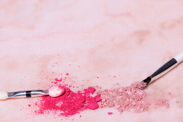 Cosmetics and beauty products on a pink marble table