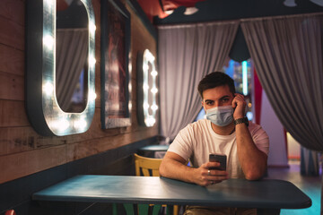 Poster - Closeup shot of a white Caucasian man posing in a cafe