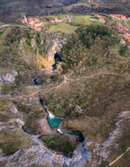 Wall Mural - Aerial view of Unesco world heritage site Skocjanske jame (Skocjan caves) with village Skocjan and collapse doline, Slovenia