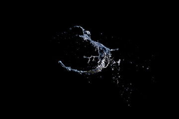 Water splash isolated on black background.