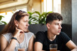© Мар'ян Філь - Mom talks to her teenage son in a cafe, the guy rolls his eyes, apparently does not want to listen to his mother's teachings, they do not have a simple family relationship