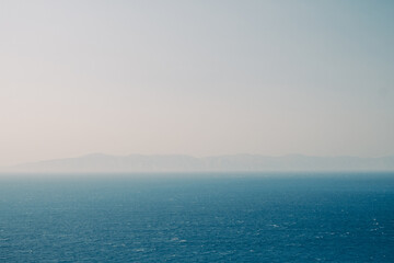 Breathtaking view of the Mediterranean sea under a pale cloudless sky