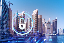 Skyscrapers Of Dubai Business Downtown. International Hub Of Trading And Financial Services. Lock Icon Hologram, Concept Of Datum Security. Double Exposure. Dubai Canal Waterfront.
