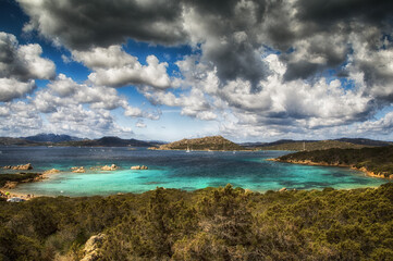 Sticker - View of a blue sea in the Arcipelago di La Maddalena national park under a cloudy sky in Italy