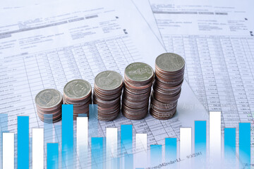 Bar graph stock market, forex trading with stack coin numeric data document. planing earn money investment and saving money future for 2022 new year. finance and business concept.